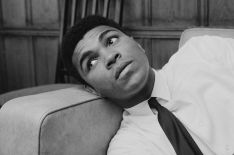 American boxer Muhammad Ali relaxes in his hotel room in London, the day after his victory over Henry Cooper at the Arsenal Stadium