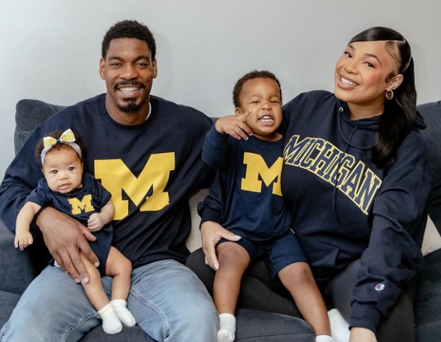 Kam Williams and Leroy Garrett with their kids