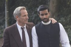 Robson Green as Geordie Keating and Rishi Nair as Alphy Kottaram walking dogs in Grantchester