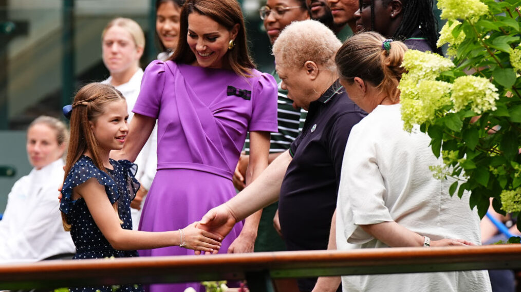 LONDON, ENGLAND - JULY 14: Catherine, Princess of Wales (2nd L) and Princess Charlotte (L) meet ground staff during a visit to the All England Lawn Tennis and Croquet Club in Wimbledon, south west London, on day fourteen of the Wimbledon Tennis Championships on July 14, 2024 in London, England. The Princess of Wales will present the trophy to the winner of the men's final. (Photo by Aaron Chown - WPA Pool/Getty Images)