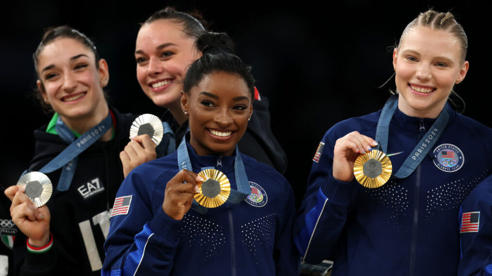 Silver medalists Elisa Iorio and Giorgia Villa of Team Italy and Gold medalists Simone Biles and Jade Carey of Team United States pose with their medals on the podium during the medal ceremony for the Artistic Gymnastics Women's Team Final on day four of the Olympic Games Paris 2024 at Bercy Arena on July 30, 2024 in Paris, France.