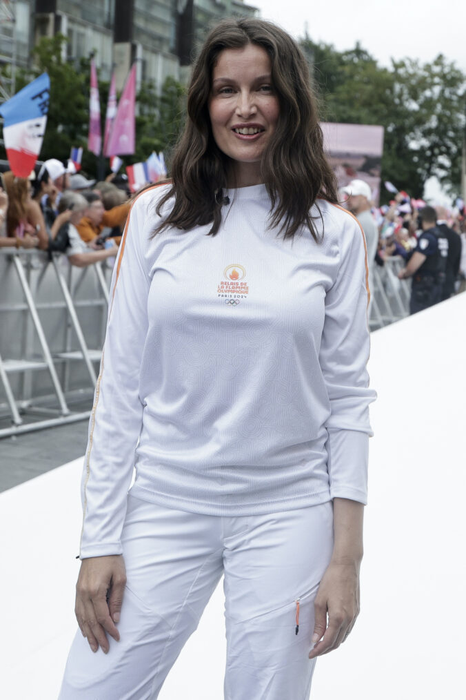 French actress Laetitia Casta during the 2024 Paris Olympic Games Torch Relay, on the day of the opening ceremony, on July 26, 2024 in Saint-Denis, outside Paris.