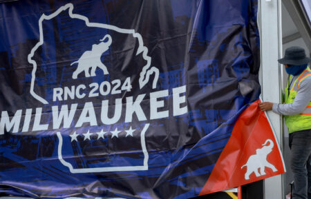 A worker helps prepare the Fiserv Forum for the start of the Republican National Convention on July 11, 2024, in Milwaukee, Wisconsin