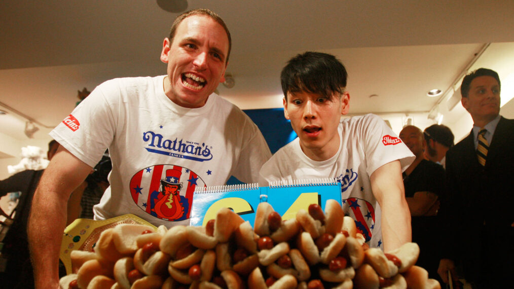 Former champion Takeru Kobayashi and reigning champion Joey Chestnut look on at the Nathan's Famous Fourth of July International Hot Dog Eating Contest official weigh-in ceremony July 2, 2009 in New York City. Chestnut defeated arch rival Kobayashi of Japan in an overtime battle last year by consuming 64 hot dog