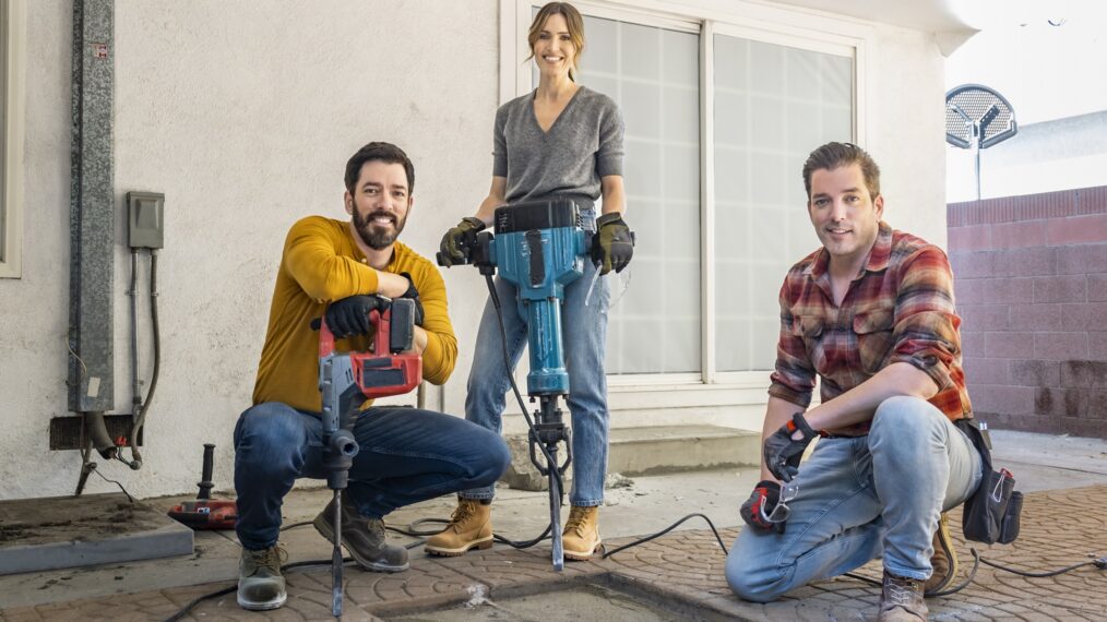 Mandy Moore, alongside Drew and Jonathan Scott, as they demo the outdoor patio area for Mandy’s longtime friend Celina