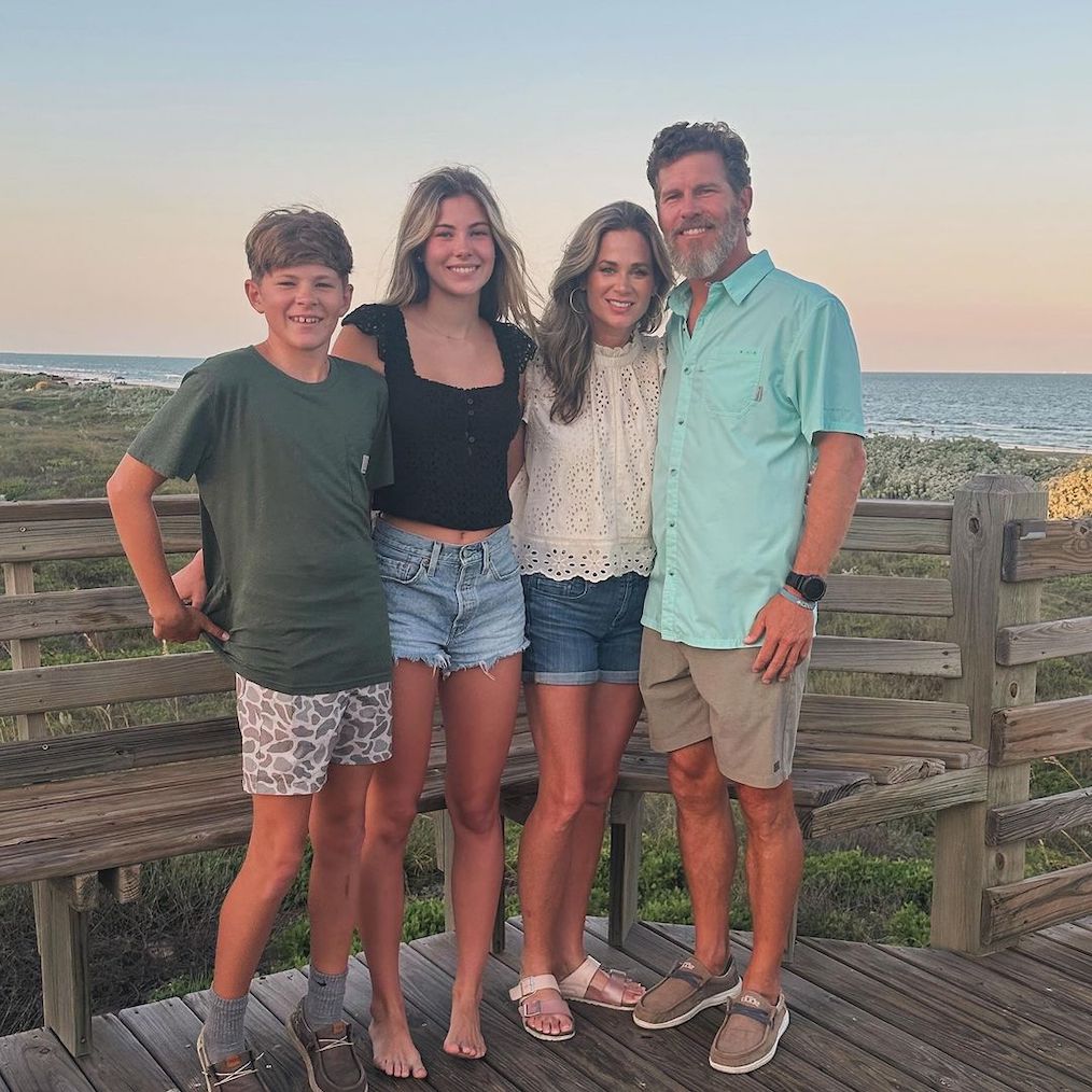 Matthew Hickle, his kids, and wife by the beach.