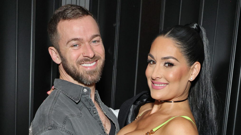 Artem Chigvintsev and Nikki Garcia attend Brie and Nikki Bella's live edition of SiriusXM's The Bellas Podcast on February 08, 2023 in Phoenix, Arizona.