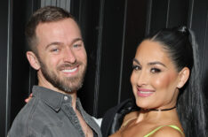 Artem Chigvintsev and Nikki Garcia attend Brie and Nikki Bella's live edition of SiriusXM's The Bellas Podcast on February 08, 2023 in Phoenix, Arizona.