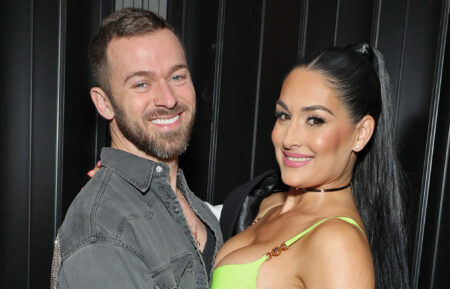 Artem Chigvintsev and Nikki Garcia attend Brie and Nikki Bella's live edition of SiriusXM's The Bellas Podcast on February 08, 2023 in Phoenix, Arizona.