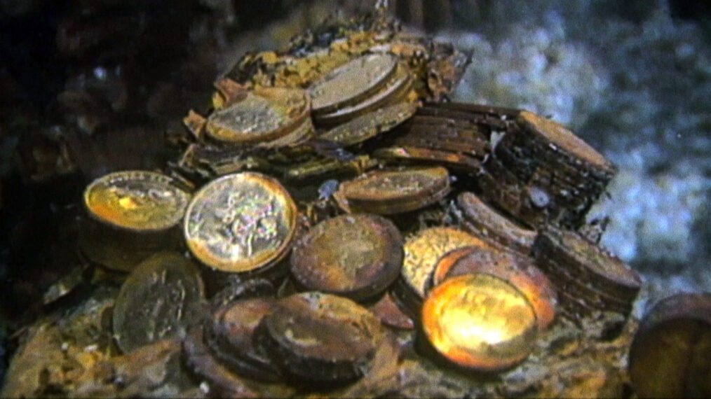 Gold coins are pictured on the bottom of the seabed off the coast of North Carolina, USA in Nat Geo's 'Cursed Gold: A Shipwreck Scandal'