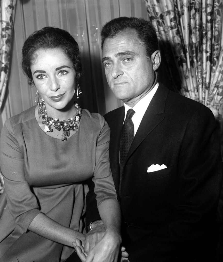 British-born film star Elizabeth Taylor holds a press conference with her third husband, American stage producer Mike Todd.