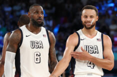 Lebron James #6 of Team United States watches as Stephen Curry #4 of Team United States celebrates towards his bench while shooting free throws during a Men's basketball semifinals match between Team United States and Team Serbia on day thirteen of the Olympic Games Paris 2024 at Bercy Arena on August 08, 2024 in Paris, France.