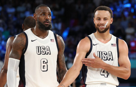 Lebron James #6 of Team United States watches as Stephen Curry #4 of Team United States celebrates towards his bench while shooting free throws during a Men's basketball semifinals match between Team United States and Team Serbia on day thirteen of the Olympic Games Paris 2024 at Bercy Arena on August 08, 2024 in Paris, France.