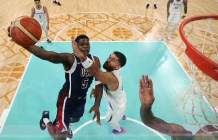 Anthony Edwards #5 of Team United States shoots over Arnaldo Toro #41 of Team Puerto Rico during a Men's basketball group phase-group C game between the United States and Puerto Rico on day eight of the Olympic Games Paris 2024 at Stade Pierre Mauroy on August 03, 2024 in Lille, France.