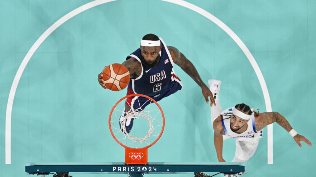 Lebron James #6 of Team United States goes up for a basket past Jose Alvarado #10 of Team Puerto Rico during a Men's basketball group phase-group C game between the United States and Puerto Rico on day eight of the Olympic Games Paris 2024 at Stade Pierre Mauroy on August 03, 2024 in Lille, France.