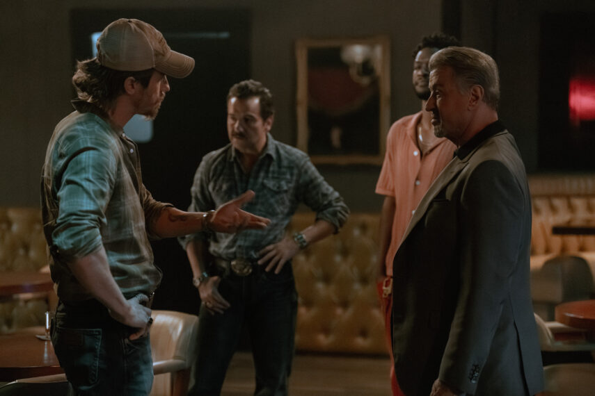 L-R: Garrett Hedlund as Mitch Keller, Max Casella as Armand Truisi, Jay Will as Tyson Mitchell, and Sylvester Stallone as Dwight "The General" Manfredi of the Paramount+ original series TULSA KING. Photo Credit: Brian Douglas/Paramount+. © 2024 Viacom International Inc. All Rights Reserved.