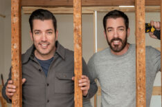 Drew Scott and Jonathan Scott pose during construction on Carolyn's home, Don't Hate Your House with the Property Brothers, Season 1.