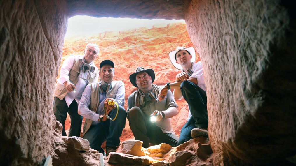 Explorer Josh Gates and Professor Pearce Paul Creasman, joined by Dr. Fares Braizat, ChiefCommissioner of the Petra Development and Tourism Region Authority and Professor FadiBalawi, Director General of the Department of Antiquities of Jordan, peering into the newlydiscovered tomb at Petra