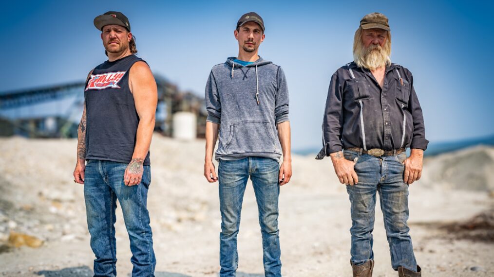 Tony Beets, Parker Schnabel, Rick Ness posing together, conveyor in background