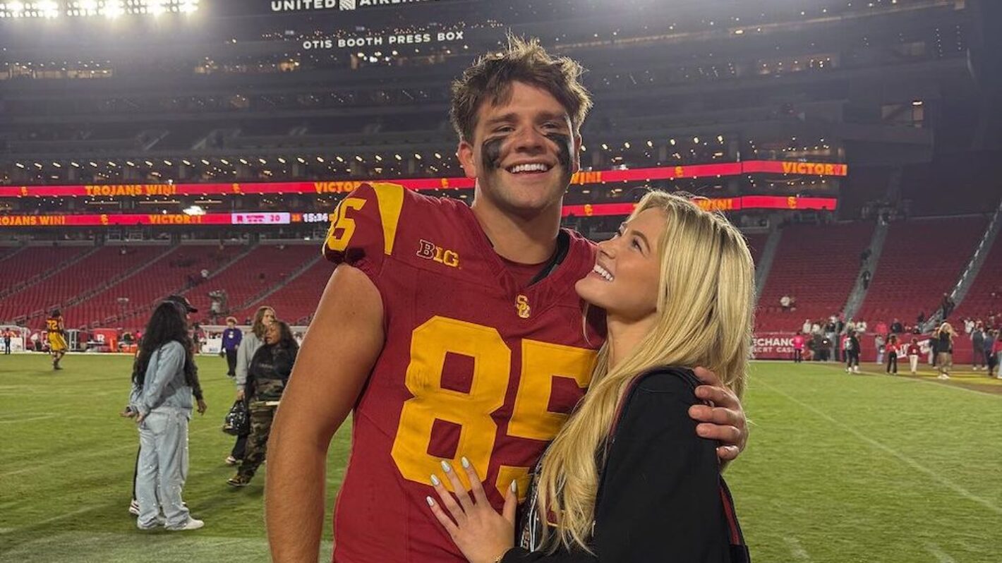 Walker Lyons and Rylee Arnold on the field at USC Trojans game.