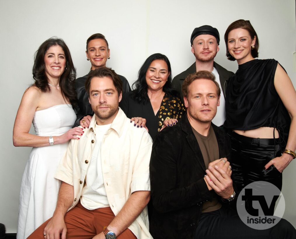 (L-R) 'Outlander's Maril Davis, Richard Rankin, Sophie Skelton, Diana Gabaldon, Sam Heughan, John Bell, and Caitríona Balfe in TV Insider's NYCC 2024 portrait studio