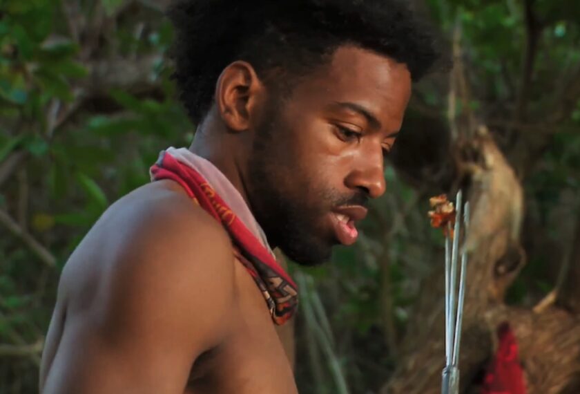 Rome eating a fish on 'Survivor' Season 47 Episode 3