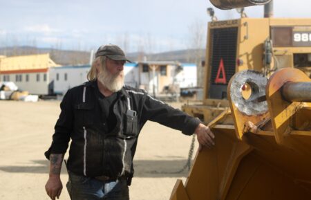 Tony Beets inspecting equipment in yard