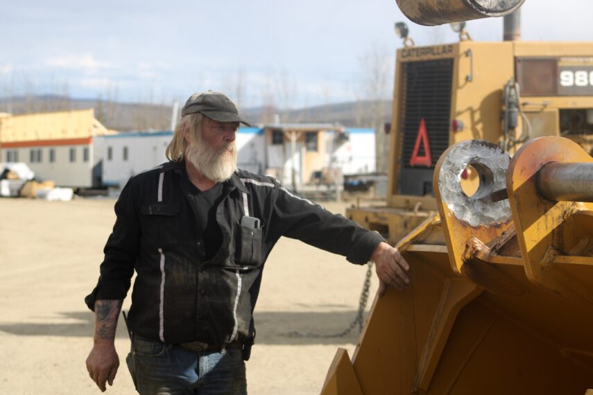 Tony Beets inspecting equipment in yard