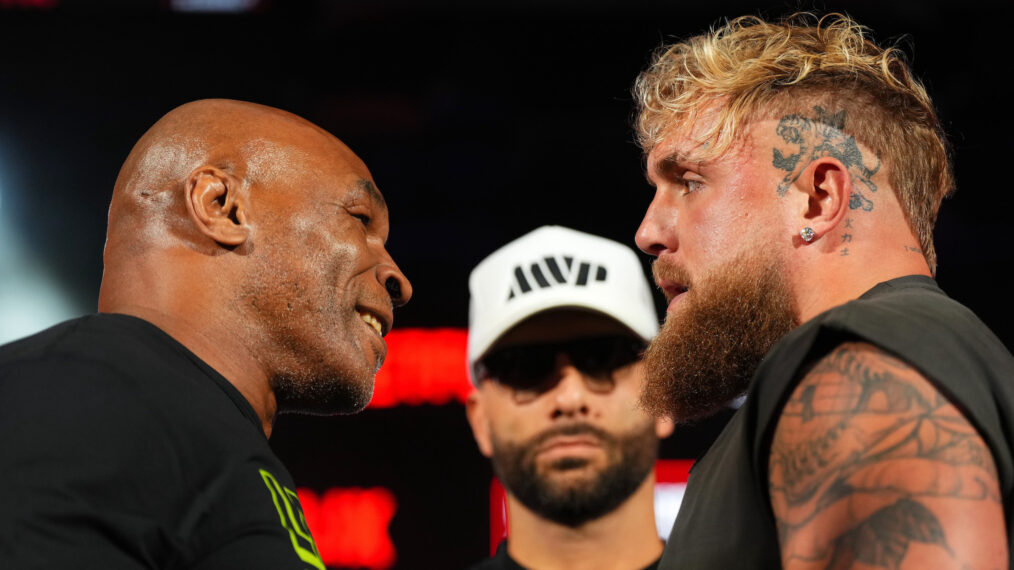 Mike Tyson, Nakisa Bidarian and Jake Paul pose onstage during the Jake Paul vs. Mike Tyson Boxing match Arlington press conference at Texas Live! on May 16, 2024 in Arlington, Texas.