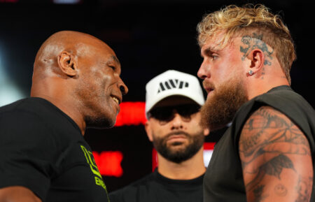 Mike Tyson, Nakisa Bidarian and Jake Paul pose onstage during the Jake Paul vs. Mike Tyson Boxing match Arlington press conference at Texas Live! on May 16, 2024 in Arlington, Texas.