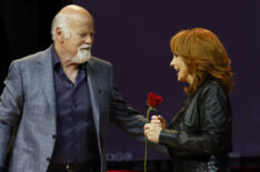 Rex Linn and Reba McEntire speak onstage during Not That Fancy: An Evening With Reba & Friends at Ryman Auditorium on November 05, 2023 in Nashville, Tennessee.