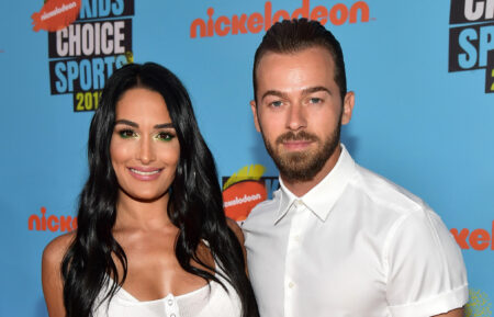 Nikki Bella and Artem Chigvintsev attend Nickelodeon Kids' Choice Sports 2019 at Barker Hangar on July 11, 2019 in Santa Monica, California.