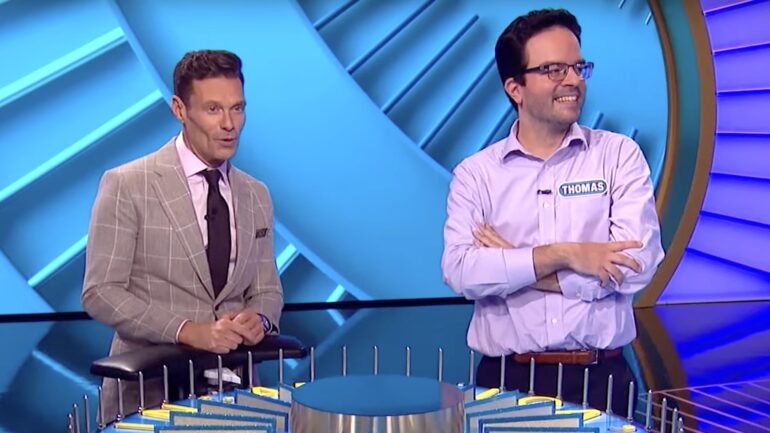 Ryan Seacrest and contestant on Wheel of Fortune