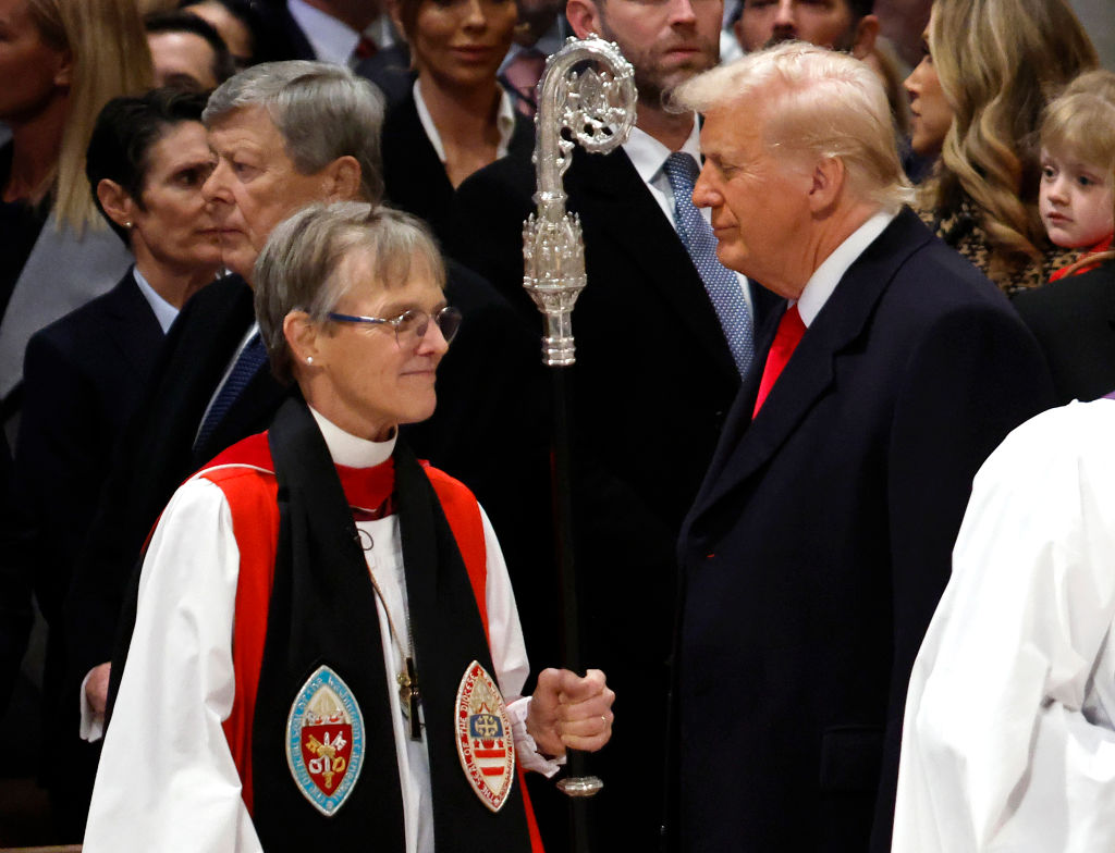 WASHINGTON, DC - JANUARY 21: (EDITOR'S NOTE: Alternate crop) Bishop Mariann Edgar Budde (L) arrives as U.S. President Donald Trump looks on during the National Prayer Service at Washington National Cathedral on January 21, 2025 in Washington, DC. Tuesday marks Trump's first full day of his second term in the White House. (Photo by Chip Somodevilla/Getty Images)