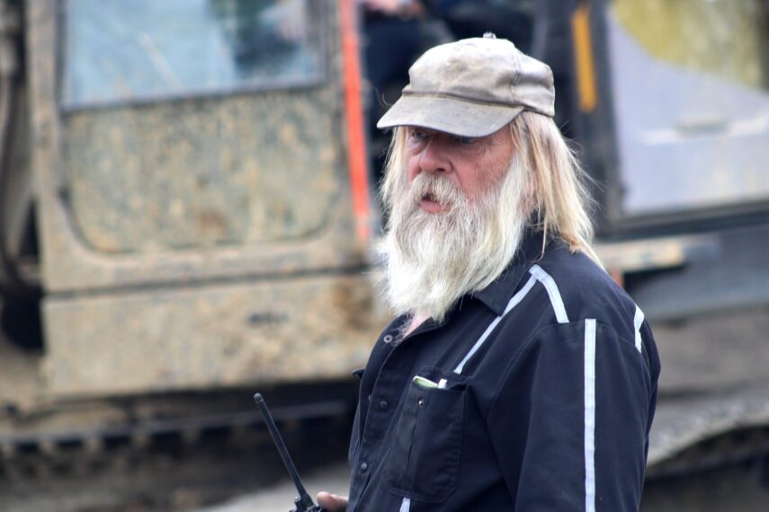 Tony Beets frustrated infront of excavator