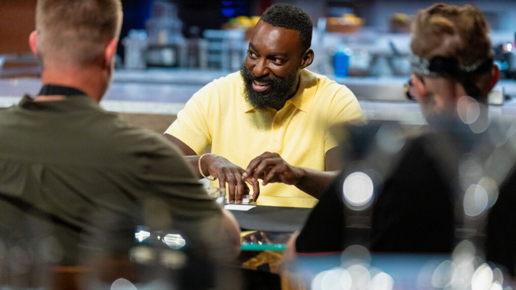 Host Eric Adjepong deals cards for round 2, as seen on Wildcard Kitchen, Season 2