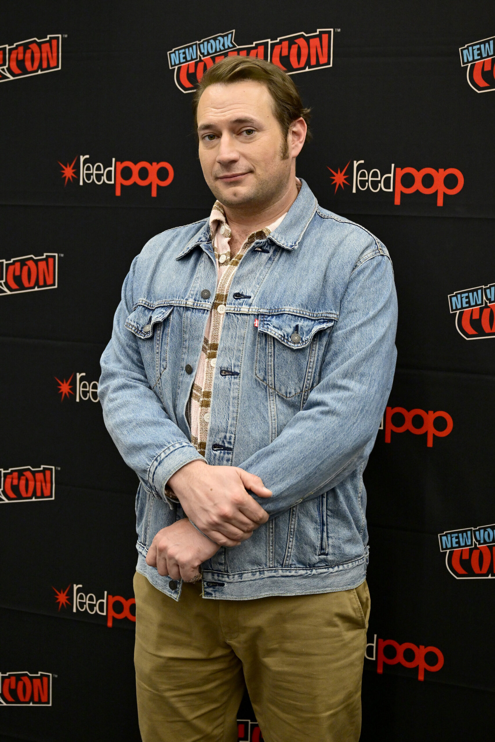 NEW YORK, NEW YORK - OCTOBER 19: Brandon Scott Jones attends Ghosts panel during New York Comic Con 2024 at The Jacob K. Javits Convention Center on October 19, 2024 in New York City.