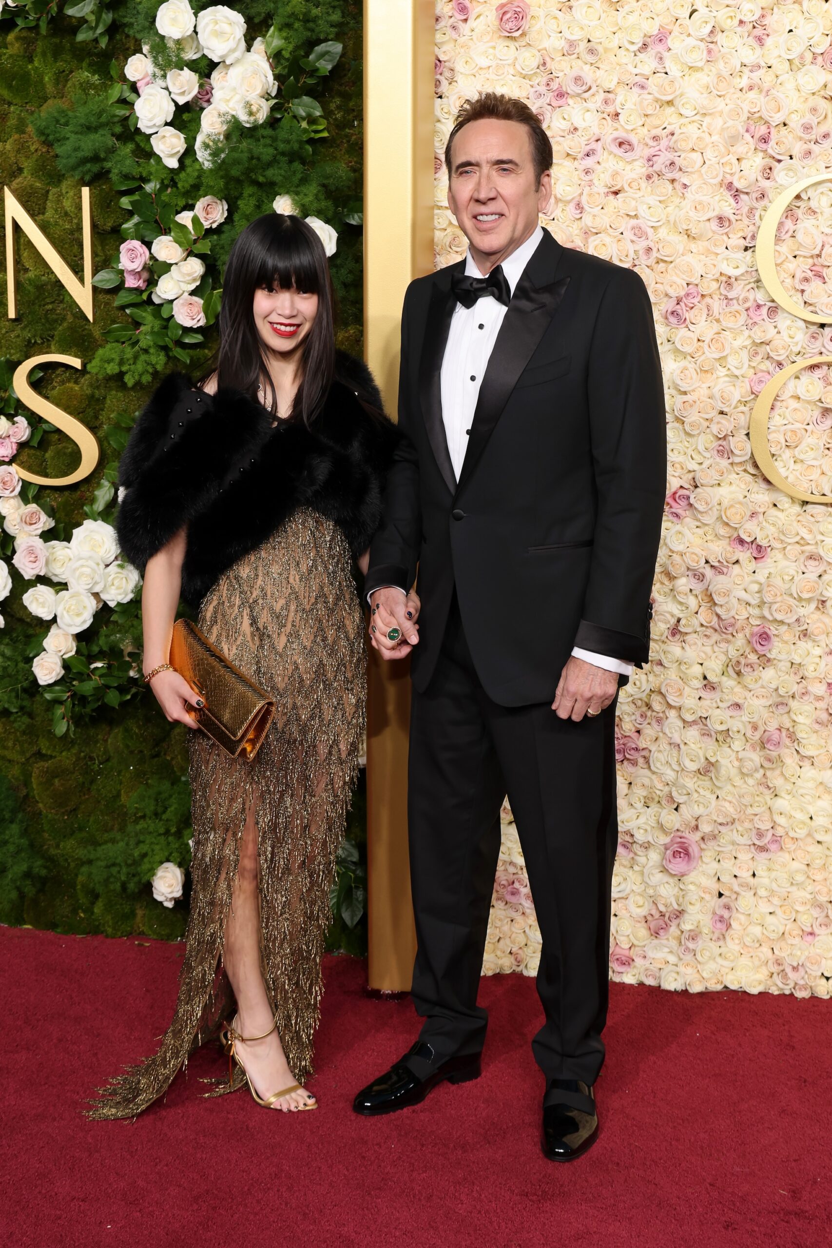 Riko Shibata and Nicolas Cage attend the 82nd Annual Golden Globe Awards at The Beverly Hilton on January 05, 2025 in Beverly Hills, California.