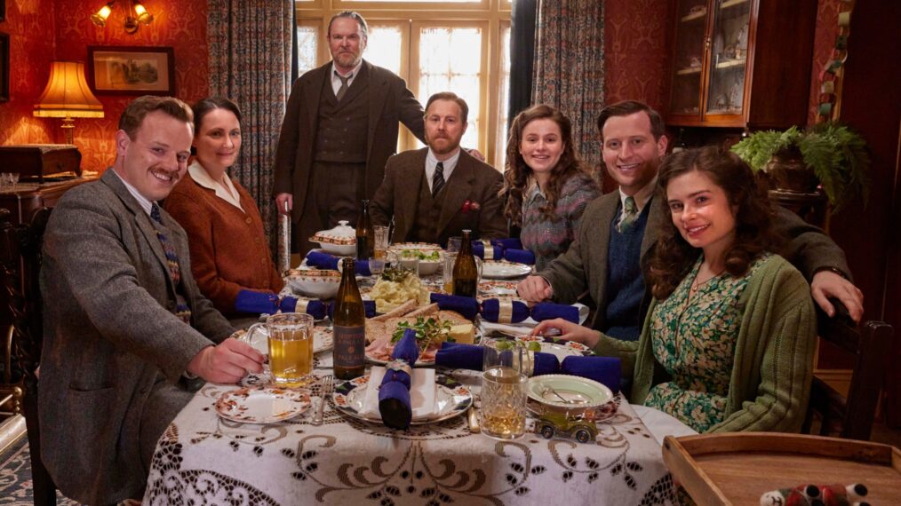 Tristan Farnon (Callum Woodhouse), Mrs. Hall (Anna Madeley), Richard Alderson (Tony Pitts), Siegfried Farnon (Samuel West), Jenny Alderson (Imogen Clawson), James Herriot (Nicholas Ralph), and Helen Herriot (Rachel Shenton) in All Creatures Great and Small Season 5 Christmas episode