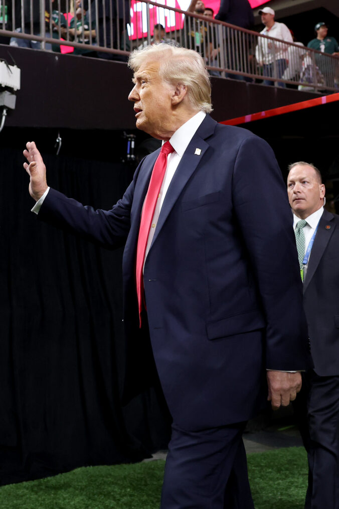 U.S. President Donald Trump walks onto the field prior to Super Bowl LIX