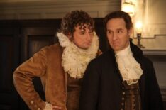 Brandon Scott Jones as Isaac and Nat Faxon as Alexander Hamilton in 'Ghosts' Season 4 - 'Alexander Hamilton and the Ruffle Kerfuffle'