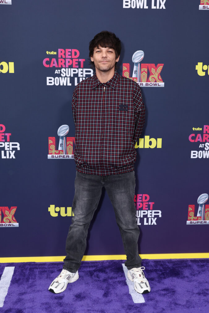 Louis Tomlinson attends the purple carpet during the Super Bowl