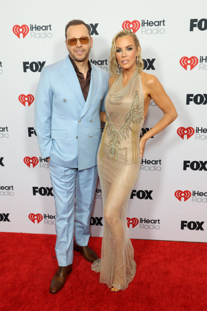 LOS ANGELES, CALIFORNIA - MARCH 17: (FOR EDITORIAL USE ONLY) (L-R) Donnie Wahlberg and Jenny McCarthy attend the 2025 iHeartRadio Music Awards at Dolby Theatre in Los Angeles, California on March 17, 2025. Broadcasted live on FOX.