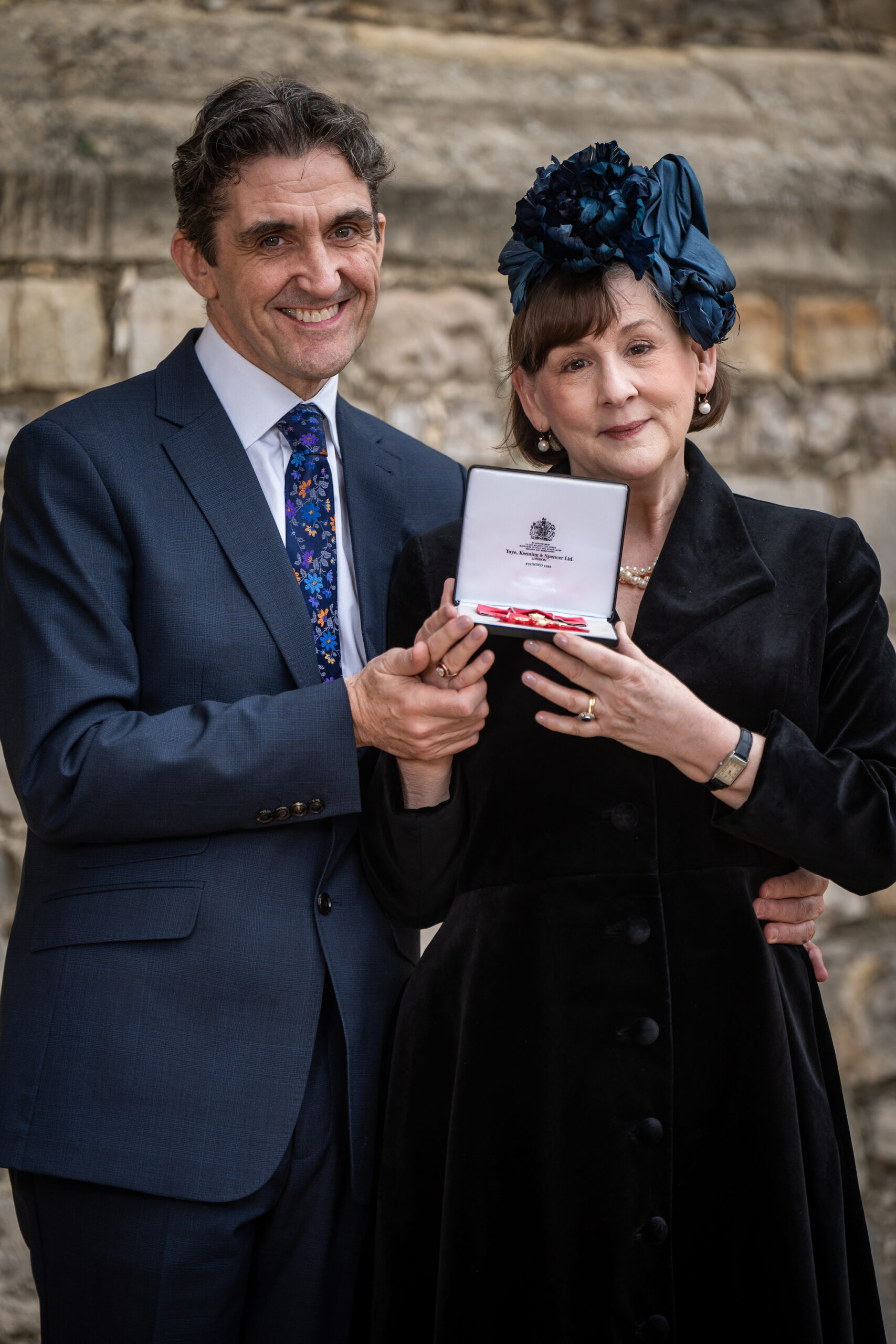 Mrs Heidi-Louise Thomas McGann, Screenwriter and Playwright, from Royston, poses with her husband Stephen McGann after being made an Officer of the Order of the British Empire by King Charles III at Windsor Castle on February 14, 2023 in London, England. The honour recognises services to drama.