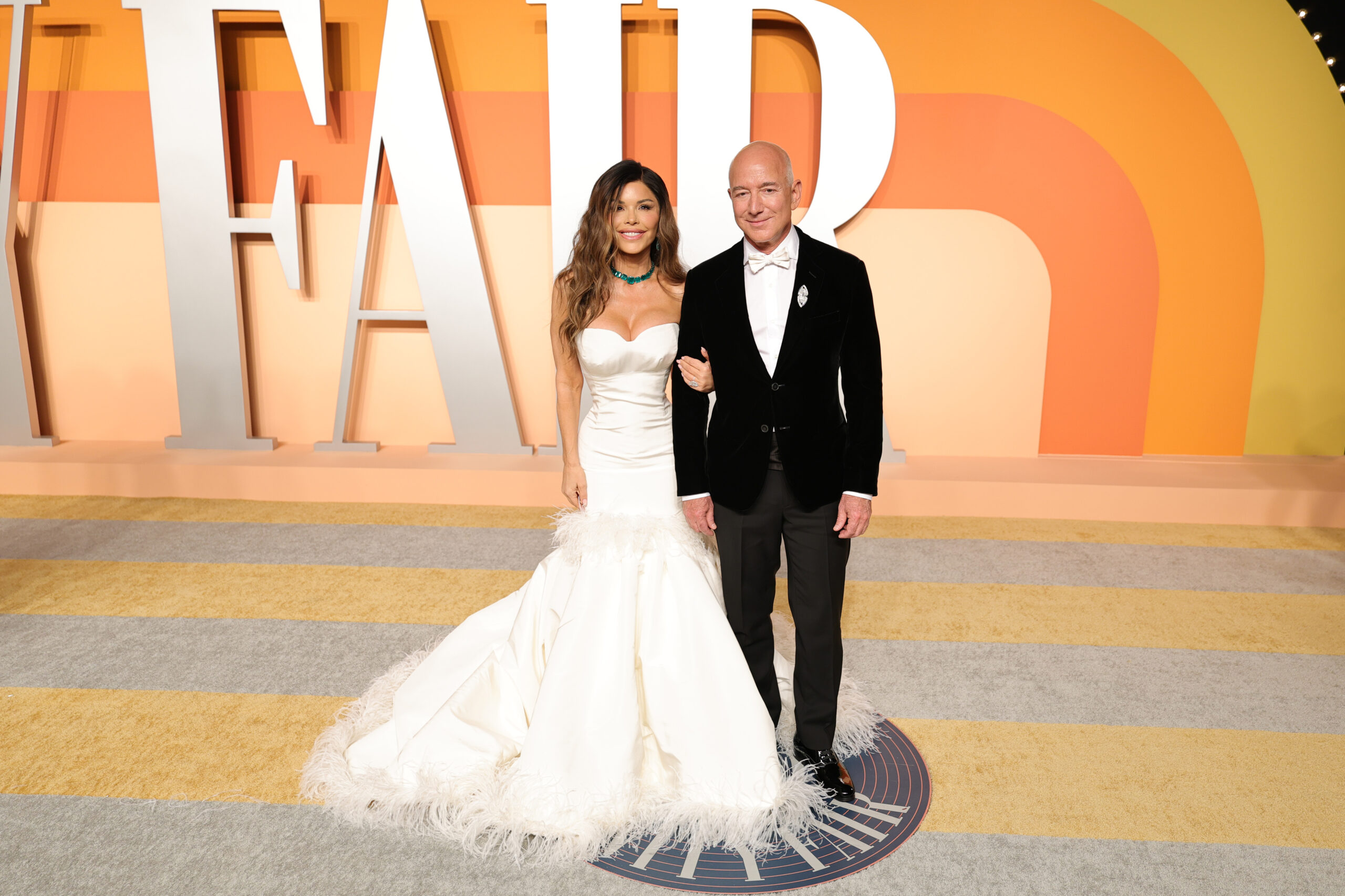 Lauren Sánchez and Jeff Bezos attend the 2025 Vanity Fair Oscar Party