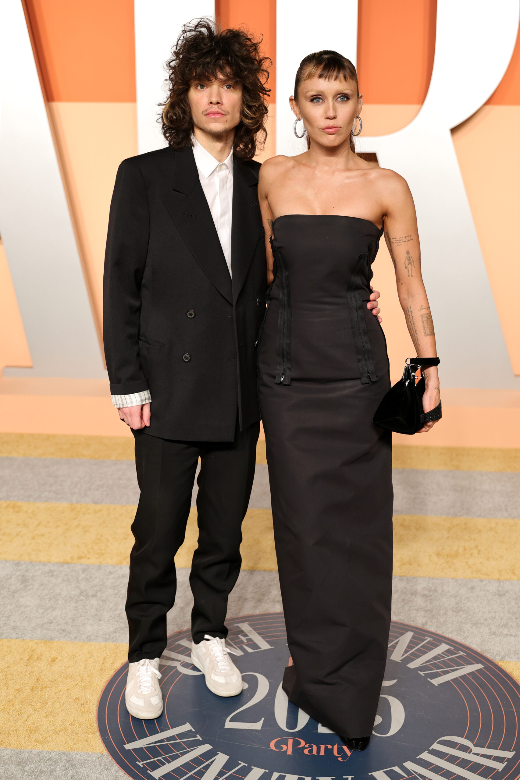 Maxx Morando and Miley Cyrus attend the 2025 Vanity Fair Oscar Party