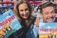 Ryan Seacrest with his sister, Meredith, holding up the book they wrote together